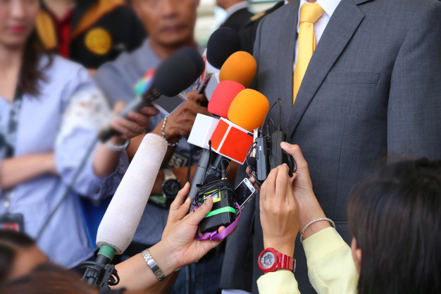 media-interview-conept-group-journalists-holdig-microphone-interviewing-vip_12892-44